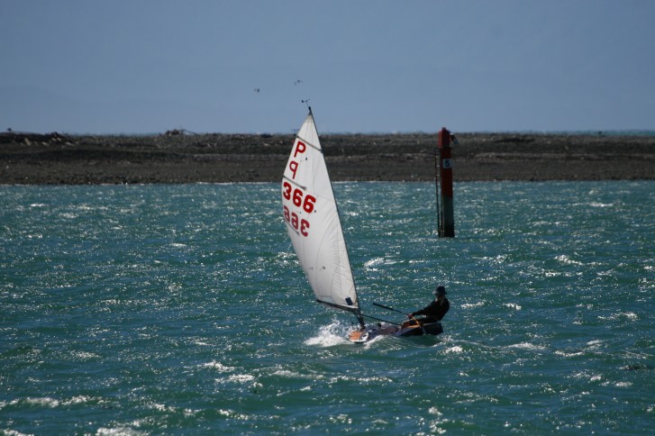 Hannah Mangin reaching across the harbour in her P