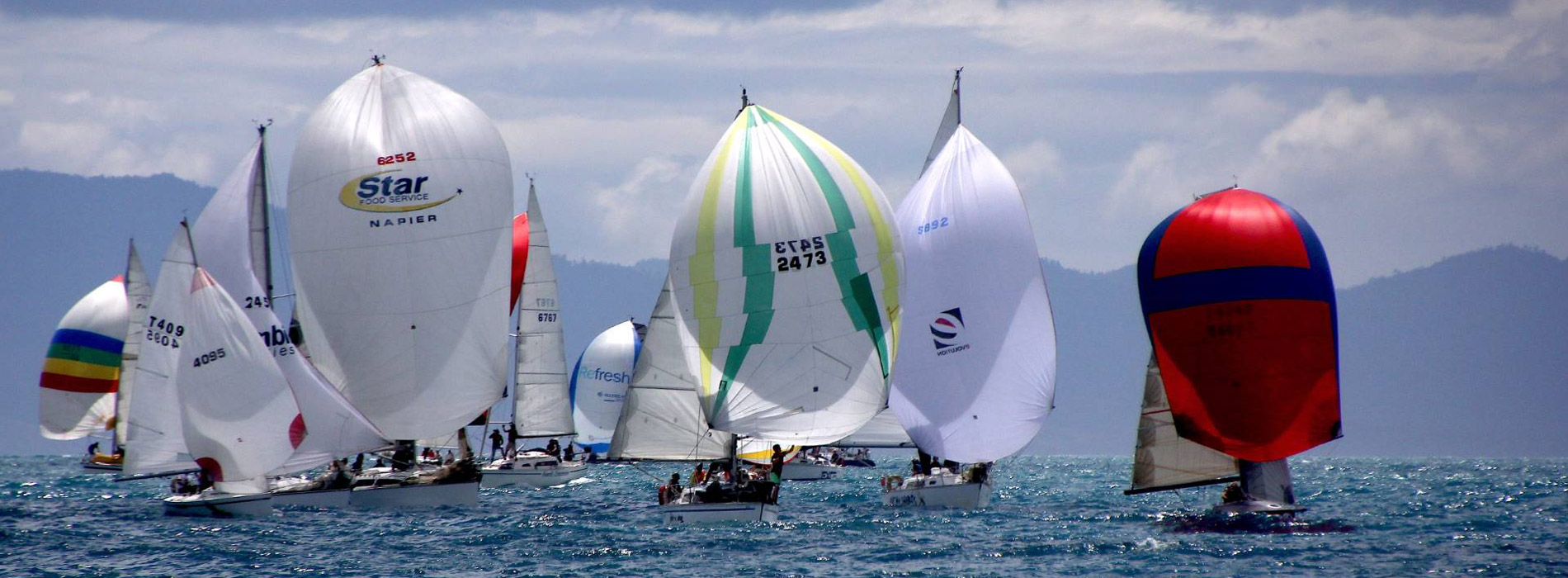 Yachts from the Tasman Bay Cruising Club with spinnakers up! 